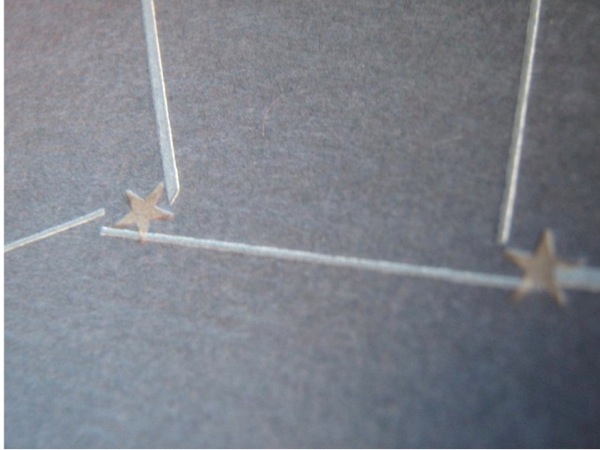 Photograph of paper stars connected with popsicle sticks