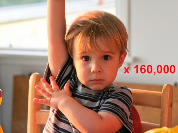 Image of a child raising his hand, annotated with *times 160,000*