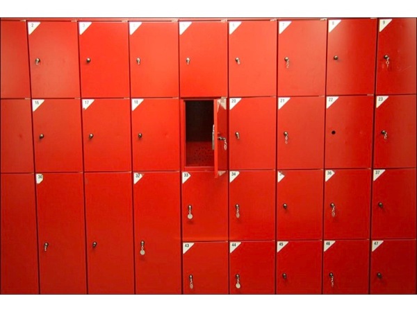 Image of red lockers, with one locker open